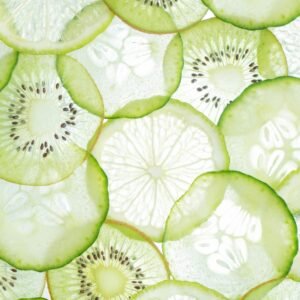 Close-up of fresh citrus and kiwi slices showcasing vibrant textures and colors.