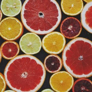 Bright and fresh assortment of colorful citrus fruit slices captured from above.